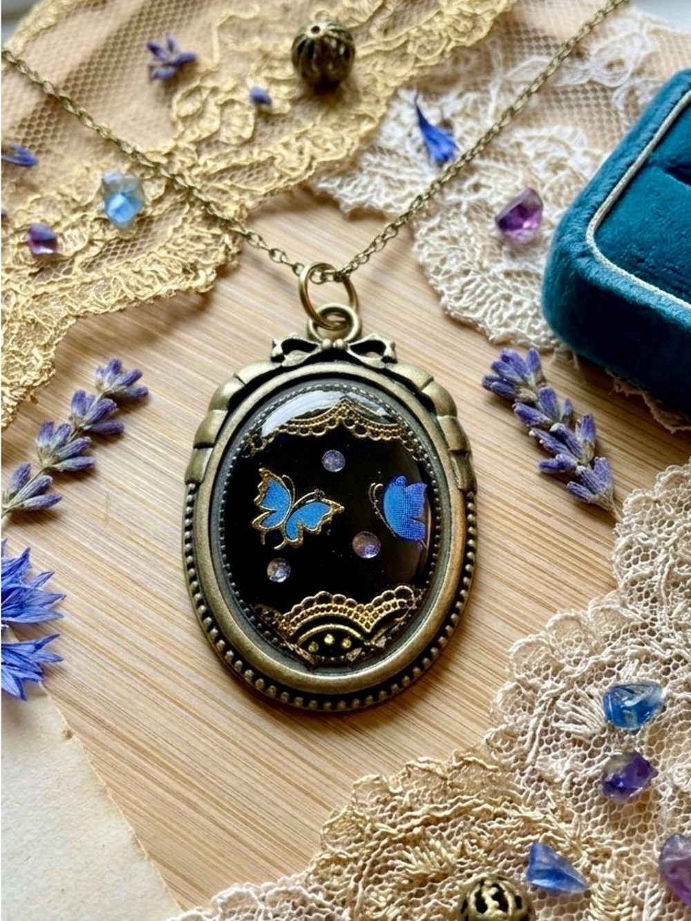 Blue Butterfly Oval Pendant Necklace in Antique Bronze